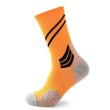 Bright orange sports sock with black dynamic stripes and grey reinforced heel and toe sections.