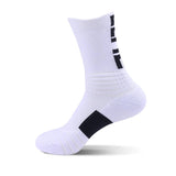 White sports sock with black accents on the heel and arch, featuring a ribbed ankle design.